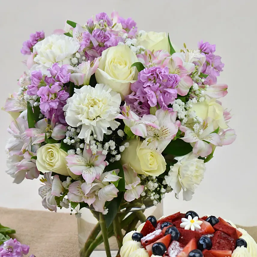 Red Velvet Cake with Pink Floral Arrangement - Image 2